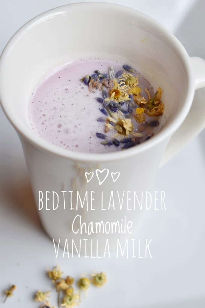 a cup filled with liquid and flowers on top of a white table next to the words bedtime lavender chamole vanilla milk