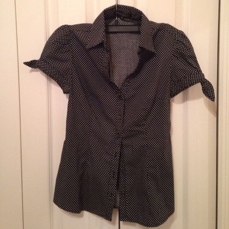 Only Worn A Few Times. Looks Brand New Very Cute Black And White Polka Dot Button Up. Has Adorable Bows On Each Short Sleeve. Retro Black Button-up Blouse, Fitted Polka Dot Button-up Blouse, Fitted Button-up Blouse With Polka Dot Pattern, Fitted Polka Dot Blouse For Work, Fitted Polka Dot Blouse With Button Closure, Polka Dot Tops With Buttons For Workwear, Polka Dot Cotton Tops With Buttons, Casual Polka Dot Blouse With Buttons, Polka Dot Tops With Button Closure For Workwear