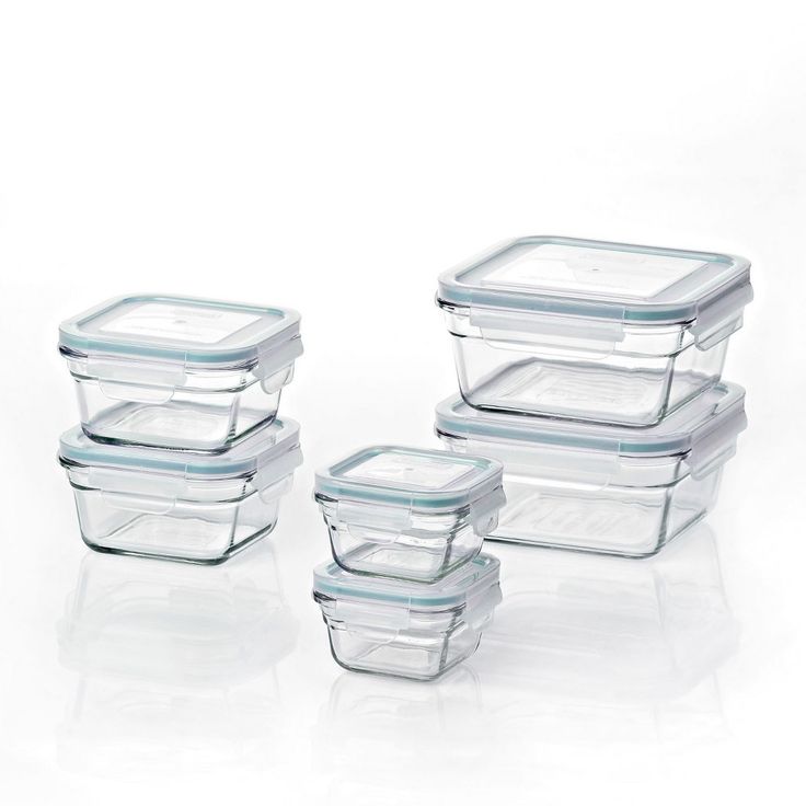 glass containers with lids are stacked on top of each other