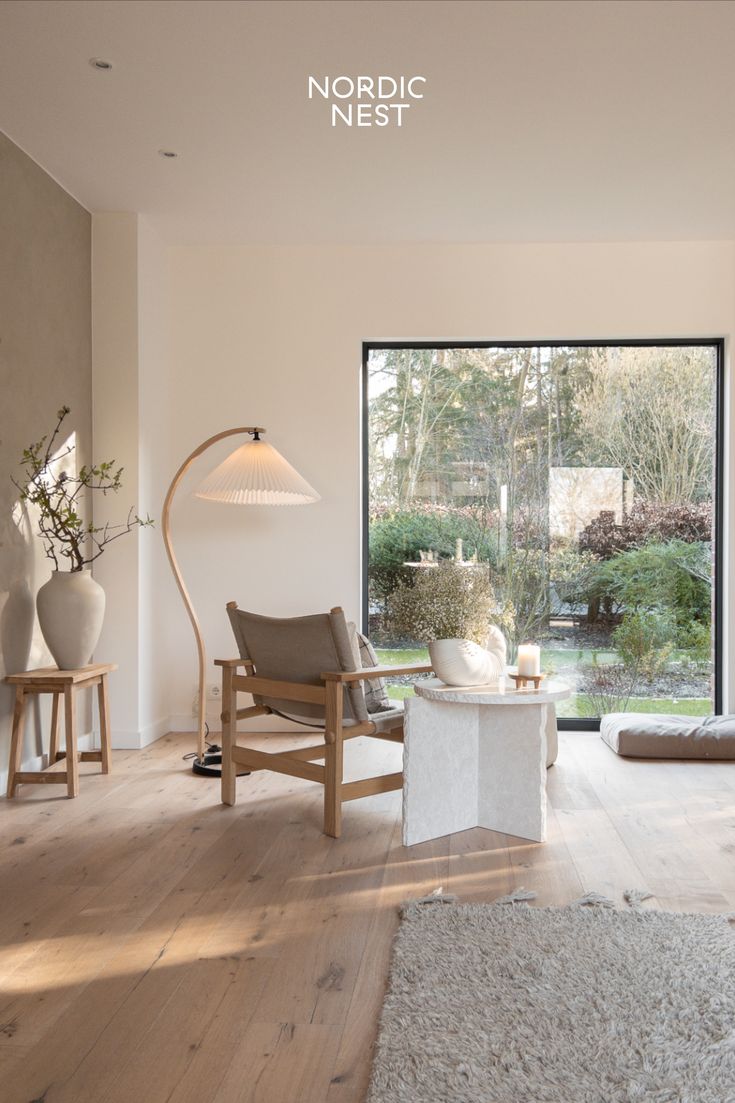 a living room filled with furniture and a large window