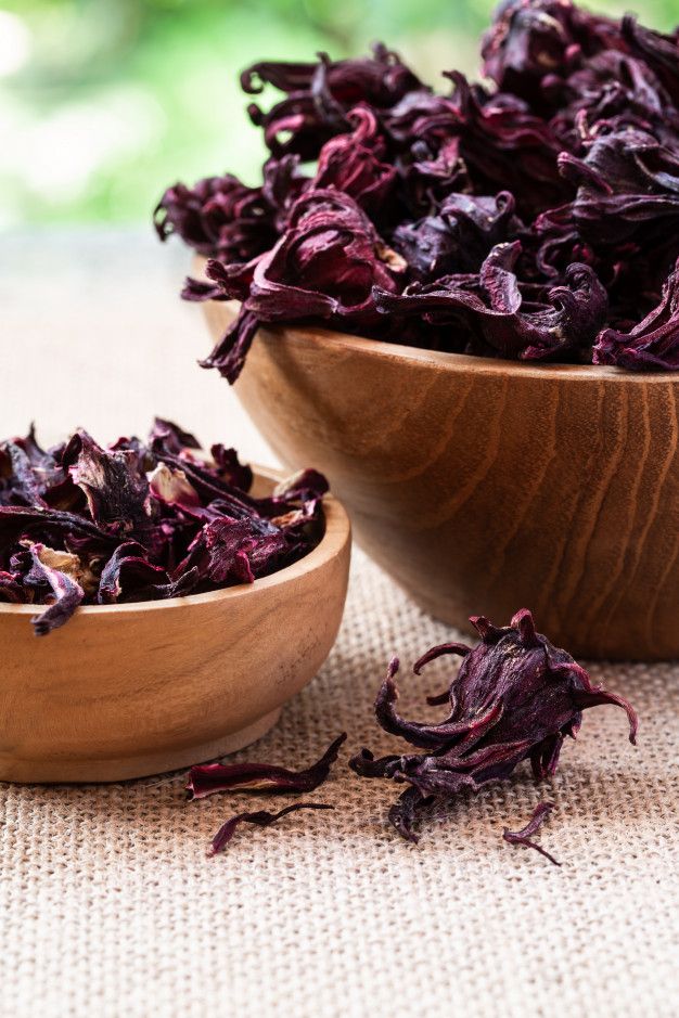 two wooden bowls filled with dried red cabbage