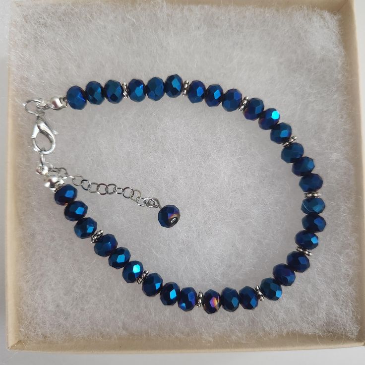 Blue Color Glass Crystal Faceted Bracelet ,Blue Beads, Blue Faceted Beads, Faceted Round Beads, Silver Spacers, Silver Clasp Approximately 7 inches, make sure this will fit your wrist. Beads used are  6 mm in diameter  All my bracelets are handmade by me. Please note -  I do my very best to give you accurate measurements and descriptions All my jewelry is delivered in a gift box and beautiful organza gift bag, perfect for keeping your jewelry safe, or ready to give if it is a gift! Colors could vary due to lighting * see more brackets at https://decowrist.etsy.com/ No refunds or exchanges Blue Beaded Bracelets With 8mm Beads For Jewelry Making, Blue Crystal Bracelet With Spacer Beads, Blue Faceted Oval Beads Jewelry, Blue Beaded Bracelets With Polished Beads As Gift, Faceted Sapphire Beaded Bracelets As Gift, Sapphire Round Faceted Bead Bracelets, Blue Faceted Beaded Bracelets As Gift, Blue Faceted Beaded Bracelets For Gift, Faceted Blue Beaded Bracelets As Gift