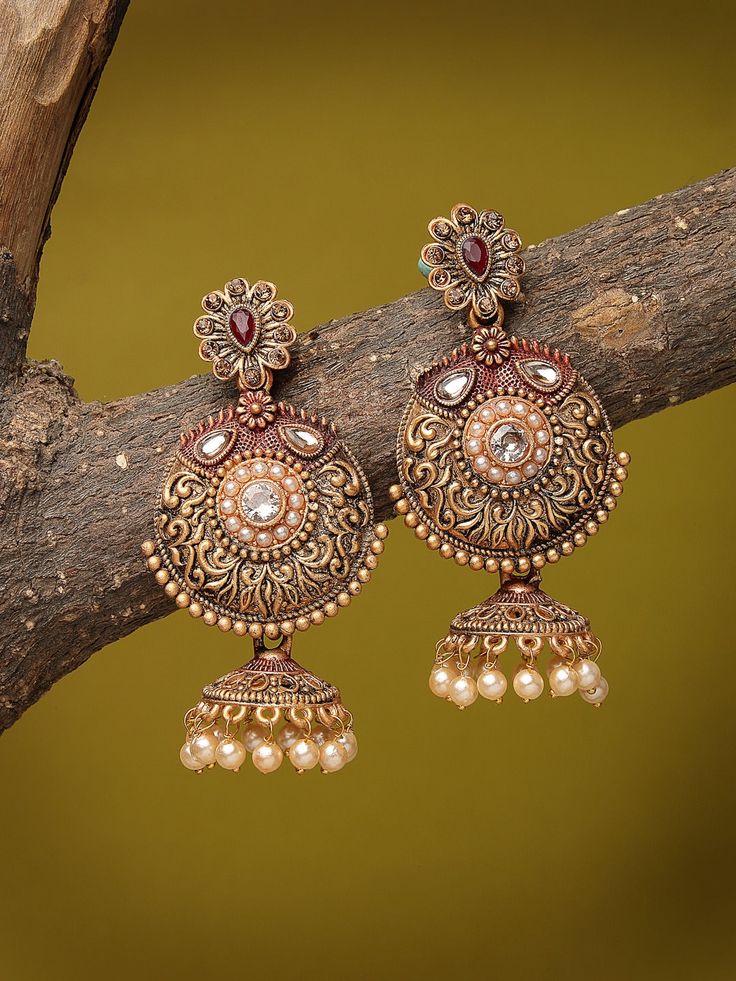 Gold-Plated Floral Jhumkas Stone Studded Earrings/Indian Jewelry/Pakistani Jewelry/Kundan Earring/CZ Ethnic Earrings/Statement Earrings Main Stone: Kundan Style : Ethnic Earrings Color : Golden Metal: Alloy Closure: Post and Back Size & Fit: Length of Earring: 6.5 CM Material & Care: Alloy and Artificial beads Care Instructions: Wipe your jewellery with a soft cloth after every use Always store your jewellery in a flat box to avoid accidental scratches Keep sprays and perfumes away from your jew Festive Temple Jewelry Pearl Earrings With Stone Work, Navratri Chandbalis With Intricate Design, Brass Chandbali Bridal Earrings, Diwali Temple Jewelry Pearl Earrings With Stone Work, Temple Jewelry Chandbali Bridal Earrings In Brass, Brass Chandbali Bridal Earrings With Tilla, Temple Jewelry Bridal Chandbali Earrings In Brass, Heavy Chandbali Earrings In Brass, Temple Jewelry Pearl Earrings With Stone Work