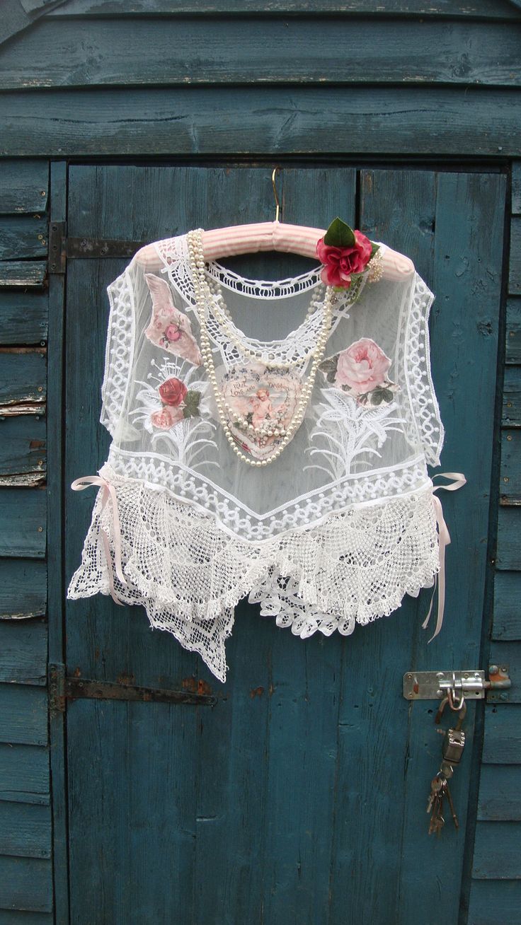 Gorgeous romantic pretty white lace layering top. This has an oversized look and could fit a few sizes depending on how loose you may want to wear it.. This beauty has been reworked and features a wide scooped neckline and exaggerated wide cap sleeves. This has a white sheer base and I have added vintage style appliques to the front and back; cherubs and florals. At the hemline, various vintage mats and doilies have been added, including a "Brugges" lace mat. This has an uneven hemline with ligh Lace Layering Top, Lace Diy Projects, Layered Lace Top, Top Layering, Lace Doily, Scooped Neckline, Lace Doilies, Layered Tops, Over Sized