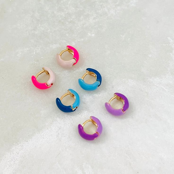 A pair of cute and colorful enamel chunky hoops. These two-tone huggie hoops are perfect for the summer and to give your outfit an extra pop of color. Please keep in mind the diameter of these huggies as they are fairly small and might not fit all earlobes!  ⭐️Item Description: Size: 13 x 6mm Diameter: 7mm Benefits: Water & Tarnish Resistant, Hypoallergenic ⭐️About Our Earrings:  Our earring collection ranges in styles to choose from. It contains the perfect earrings to complement and highlight Colorful Huggie Earrings, Trendy Pink Huggie Earrings, Pink Enamel Hoop Earrings, Pink Hypoallergenic Small Hoop Huggie Earrings, Multicolor Huggie Earrings For Gift, Multicolor Huggie Earrings As Gift, Simple Studs, Beautiful Features, Earring Collection