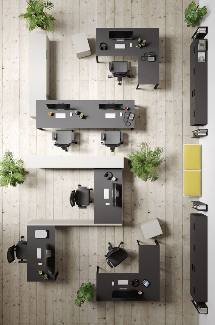 overhead view of an office with desks, chairs and planters on the wall