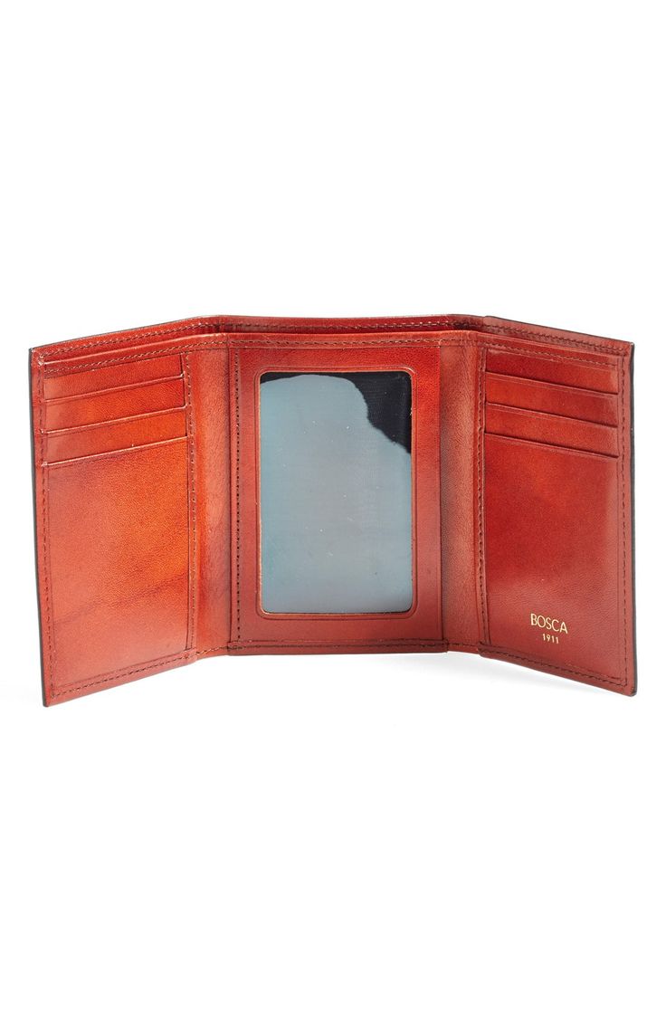 Richly burnished leather structures a spacious wallet with meticulous stitching. Style Name:Bosca 'Old Leather' Trifold Wallet. Style Number: 569392. Classic Trifold Wallet With Id Window, Formal Trifold Card Holder With Coin Pocket, Formal Trifold Wallet With Id Window, Classic Trifold Card Holder For Formal Occasions, Elegant Rfid Blocking Trifold Wallet, Classic Trifold Card Holder With Id Window, Leather Trifold Card Holder, Classic Trifold Card Holder With Smooth Grain, Elegant Trifold Wallet With Card Slots