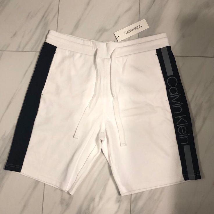 Men’s Calvin Klein Sweatshorts Price Is Firm At $45. Color: White/Black/Gray Condition: 10/10 New W Tags Sporty Calvin Klein Cotton Bottoms, Sporty White Shorts With Short Inseam, Calvin Klein Cotton Shorts For Loungewear, Calvin Klein Casual Sport Bottoms, Calvin Klein Sporty Bottoms For Sports, Calvin Klein Casual Summer Shorts, Calvin Klein Loungewear Summer Shorts, Calvin Klein Summer Loungewear Shorts, White Knee-length Shorts For Streetwear