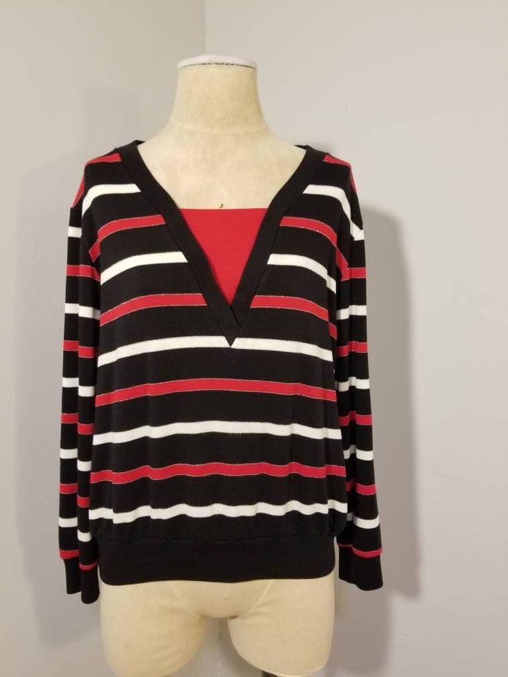 "++ VINTAGE STRIPED SHIRT ++ Black, red, white and silver striped shirt V neck Long sleeve No size tags - would best fit a size M/L Unisex In wonderful vintage condition ✂ - - - Measurements laid flat: Pit to pit: 23\" Waist: 22\" Top to bottom: 23\" Let's be friends! https://www.facebook.com/TheGirlSaidYesVintage round rack" V-neck Tops With Contrast Stripes For Spring, Red Long Sleeve Tops With Contrast Stripes, Red Long Sleeve Top With Contrast Stripes, Fall V-neck Top With Striped Collar, Fall Striped Collar V-neck Top, Retro Striped V-neck Top, Red Top With Striped Collar For Spring, Summer V-neck Top With Contrast Stripes, Retro Tops With Contrast Stripes For Fall