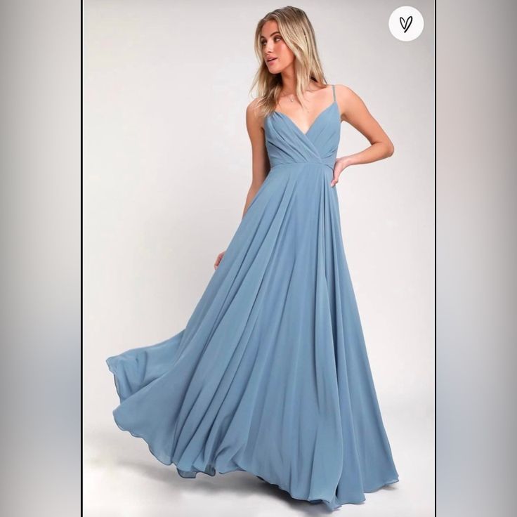 a woman in a blue dress is on sale