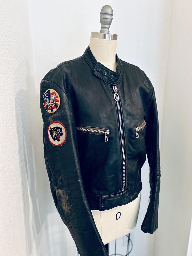 Vintage 1970s BAD GIRL Black Leather Biker Jacket w/super cool patches! Distressed Classic Moto Style Made by "Harro Kombi" - made in Germany 100% leather, distressed  Size M (medium) Chest:  36" Sleeve:  24.5" Length:  23.5" Shoulder to shoulder: 18" Condition: All zips & poppers in perfect working condition COOL DISTRESSED CONDITION Vintage Leather Motorcycle Jacket With Long Sleeves, Vintage Leather Jacket For Motorcycling, Vintage Brown Biker Jacket For Motorcycling, Vintage Fitted Biker Jacket For Winter, Retro Fitted Biker Jacket With Long Sleeves, Retro Fitted Long Sleeve Biker Jacket, Fitted Cafe Racer Biker Jacket For Motorcycling, Vintage Long Sleeve Biker Jacket For Motorcycling, Vintage Fitted Biker Jacket With Long Sleeves