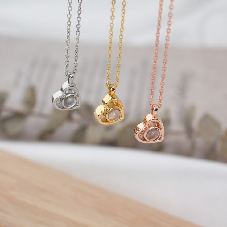 Capture your precious moment and wear it with a necklace.🎇 With the Projection Necklace packaged in a gift box, 🎁 it also makes it a thoughtful and memorable gift for loved ones on special occasions such as Valentine's day, Christmas, Mother's Day, or Thanksgiving.  💍The Projection Necklaces are made of the highest quality brass or solid 925 sterling silver with a Gold / Silver / Rose gold finish. Nickle, lead, and cadmium is not contained, 100% hypoallergenic to sensitive skin.💕Long-lasting Personalized Rose Gold Heart Necklace For Her, Rose Gold Necklace For Best Friend Valentine's Day, Rose Gold Necklace For Best Friend On Valentine's Day, Valentine's Day Birthstone Necklace For Best Friend, Rose Gold Stainless Steel Charm Necklaces For Mother's Day, Rose Gold Charm Necklaces For Valentine's Day Anniversary, Rose Gold Charm Necklaces For Anniversary On Valentine's Day, Rose Gold Clavicle Chain Charm Necklace As Gift, Round Heart Necklace With Clavicle Chain As Gift