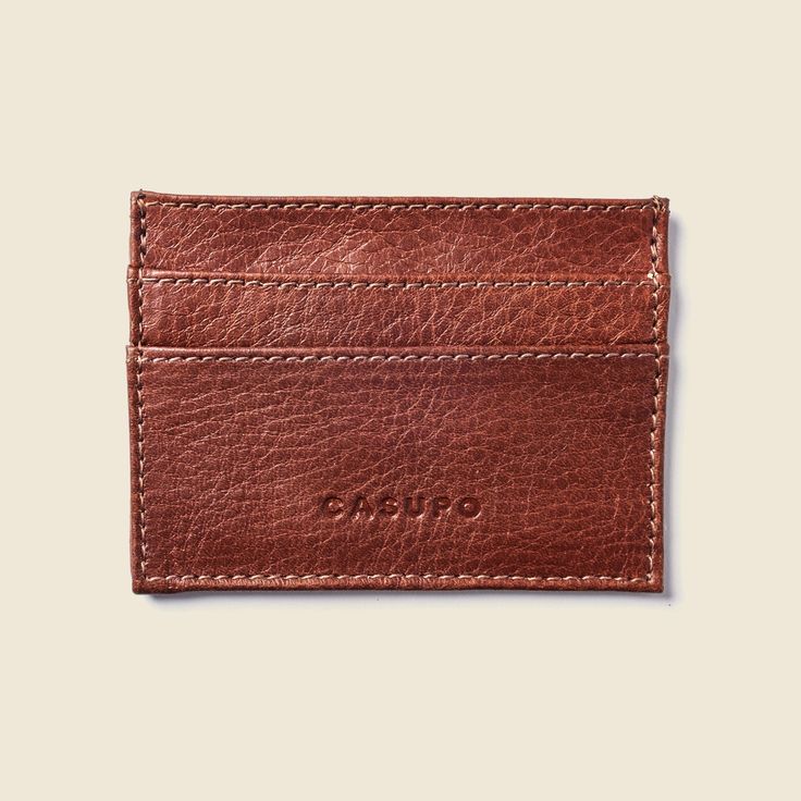 Designed for the minimalist to carry their most essential items only. Carry only a couple of cards with some cash in the middle pocket or stack up to 3 cards in each pocket for a total of 12 cards. This wallet can be personalized with your initials embossed centered on the lower back. NOTE: Monogrammed orders are final sale and can't be returned. This handcrafted product was created using sustainable leather from responsible tanneries in order to lessen its environmental impact. It was naturally Slim Leather Wallet, Sustainable Leather, Face Mask Black, Leather Wear, Pocket Wallet, Essential Items, Aging Beautifully, Minimalist Wallet, The Minimalist