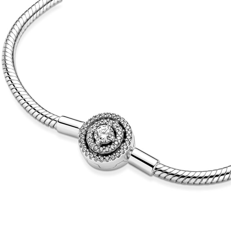 Bring timeless charm to your look with the Pandora Moments Halo Snake Chain Bracelet. Hand-finished in sterling silver, the bracelet's clasp features a large sparkling clear cubic zirconia center stone surrounded by a double halo set with small stones, designed to create a spacious, free-floating look. Fill the bracelet with charms and clips, wear it on its own for a simply elegant look, or stack it with contrasting bracelets for a fun play on textures. Bracelet With Charms, Bracelet Pandora, Snake Chain Bracelets, Mesh Bracelet, Double Halo, Pandora Bracelets, Bracelet Clasps, Silver Gifts, Pandora Bracelet