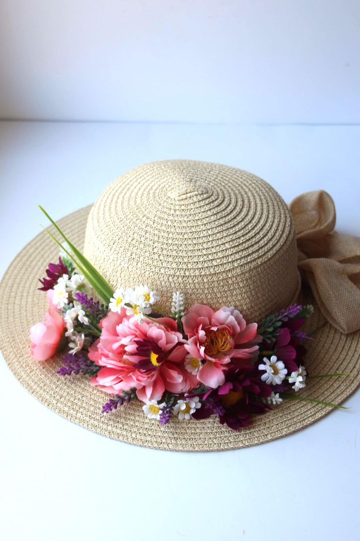 Summer hat with artificial flowers, bright floral head accessory. Elevate your summer style with this stunning hat adorned with vibrant artificial flowers. The delicate artificial flowers add a touch of elegance and charm, while the wide brim provides ample shade and protection from the sun. Whether you're lounging by the pool or strolling through a flower-filled meadow, this hat will keep you looking chic all season long.  A must-have addition to any fashion-forward woman's wardrobe. The hat fits a head diameter of 58 cm, there is a tape to adjust the size to your head. Free shipping in the USA. Thank you for visiting my shop! Enjoy. Iuliia Luxury Handmade Flower Mini Hats For Party, Sun Hat With Flowers, Pink Bohemian Sun Hat For Garden Party, Bohemian Pink Sun Hat For Garden Party, Bohemian Hats For Spring Picnic, Bohemian Spring Hats For Picnic, Adjustable Flower Hats For Vacation, Bohemian Sun Hat For Spring Garden Party, Floral Sun Hat For Spring Vacation