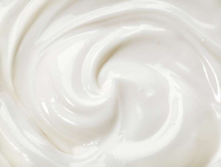 a close up view of the white cream that has been swirled into it's shape