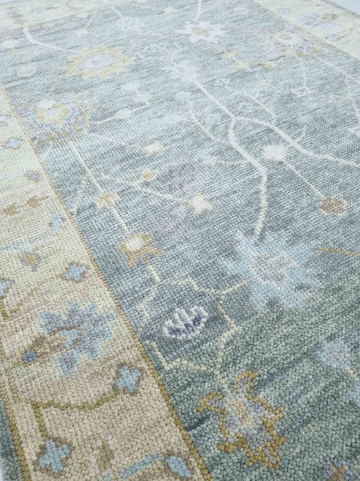 an area rug with blue and beige colors