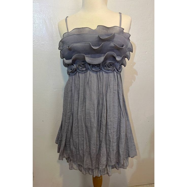 Mini Dress In A Light Blue/Grey Ish Color. Bottom Is A Gauzelike Fabric With A Second Slip Layer Underneath. Top Has A Chiffon Type Ruffles With Fabric Roses Under. Back Is Stretchy, Adjustable Straps. Fits S/M. Never Worn. Gray Summer Party Dress, Gray Sleeveless Ruffled Dress, Sleeveless Gray Dress With Ruffles, Gray Sleeveless Dress With Ruffles, Gray Mini Party Dress, Chic Gray Ruffled Dress, Chic Gray Dresses With Ruffles, Chic Gray Dress With Ruffles, Gray Mini Cocktail Dress