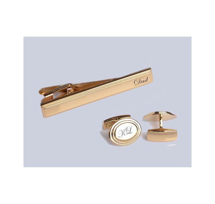 "This gold cufflink & tie clip set can be custom engraved with names and dates or monogrammed with initials. These personalized cufflinks & tie clip have a beautiful high polished gold finish surrounded by a beveled edge frame to create a stylish accent to any cuffs. Our custom cufflink & tie clip sets make great personalized wedding gifts for your groomsmen and best man. All of our high quality cufflinks and tie clips are precision laser engraved by our expert team of engravers with a very quick turnaround time. Gold Beveled Edge Oval Cufflinks & Tie Clip Set Swivel back Cufflink Dimensions: 0.75\" x 0.625\" Tie Clip Dimensions: 2.2\" x 0.3\" Black Leatherette Gift Box Included How To Send Engraving Instructions: When you are ready to order click ADD TO CART.  During checkout fill out the Gold Suit And Tie Accessories For Father's Day, Classic Gold Cufflinks For Wedding, Classic Gold Wedding Cufflinks, Classic Gold Suit And Tie Accessories, Elegant Gold Rectangular Suit And Tie Accessories, Classic Gold Cufflinks For Wedding Gift, Classic Cufflinks With Engraving Option As Wedding Gift, Elegant Cufflinks With Engraving Option For Father's Day, Gold Jewelry For Father's Day Formal Events