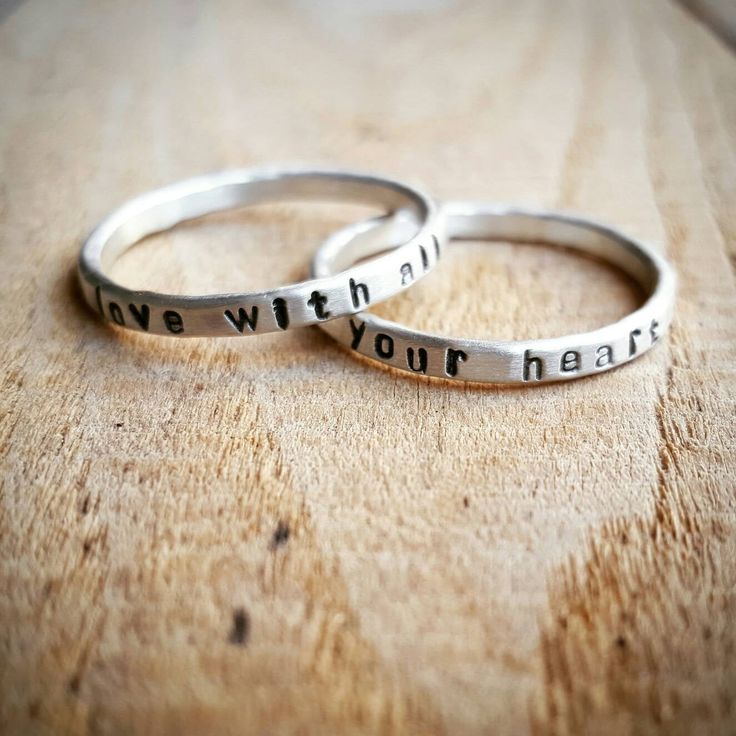 "This personalized hammered ring is hand stamped with the quote or word of your choice. I form these rings from thick sterling silver wire and then hammer them to size. It leaves them with a subtle hammered finish. I then hand stamp the quote onto the rings. They are skinny yet thicker than some of my other name rings. These rings are available in sterling silver or 14K gold and are approximately 2mm wide. In the photos, the rings have a matte finish, but they can also have a shiny or brushed fi Adjustable Engraved Sterling Silver Stackable Rings, Hand Stamped Sterling Silver Stackable Rings For Wedding, Sterling Silver Hand Stamped Stackable Rings For Wedding, Hammered Sterling Silver Engraved Promise Ring, Sterling Silver Hammered Engraved Promise Ring, Hammered Sterling Silver Promise Ring, Inspirational Adjustable Sterling Silver Rings, Adjustable Inspirational Sterling Silver Rings, Meaningful Stackable Engraved Sterling Silver Ring