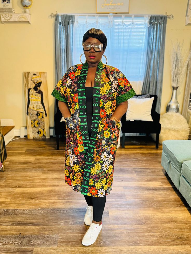 This beautiful African print kimono with unique color. This gorgeous piece will go with any outfit in your closet. African Print Kimono Jackets, Oversized Multicolor Wrap Kimono, Multicolor Long One-size Kimono, Multicolor Floral Print Kimono One Size, One Size Multicolor Floral Print Kimono, One Size Patterned Kimono, Oversized Multicolor Open Front Kimono, Multicolor Floral Print Wrap Robe, Multicolor Printed Kimono With Kimono Sleeves