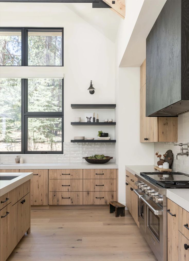 a kitchen with wooden cabinets and stainless steel appliances