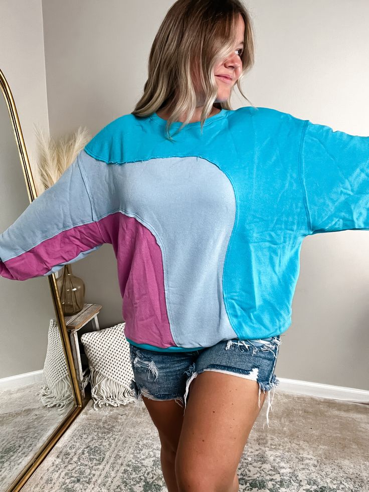 Embrace the 90's nostalgia with our Block Party Oversized French Terry Sweatshirt. This trendy pullover features an oversized silhouette and raw hem details for a playful and effortless look. Stay cozy and stylish in this elevated take on a classic. Fits true-to-size with a relaxed fit; Bethany is 5’4” 175lb and wearing a size large.Paired w/ our Alaina Denim Shorts- Relaxed fit- Drop shoulder sleeves- Exposed seam detailsMaterial: 74% cotton 26% polyester Casual Color Block Sweatshirt For Loungewear, Color Block Sweatshirt For Loungewear, Color Block Relaxed Fit Sweatshirt For Loungewear, Relaxed Fit Color Block Sweatshirt For Loungewear, Trendy Color Block Sweatshirt For Loungewear, Trendy Blue Drop Shoulder Tops, Color Block Crew Neck Sweatshirt For Loungewear, Color Block Cotton Sweatshirt With Relaxed Fit, Oversized Cotton Color Block Sweatshirt