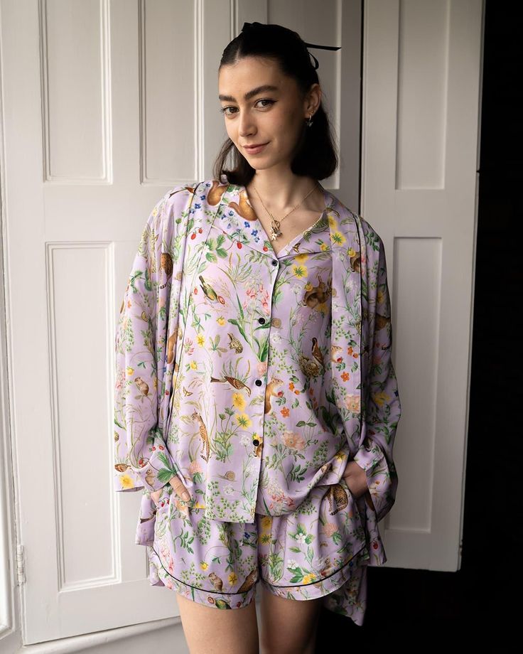 Our shorter length, kimono robe in our feminine Lilac print, from the Meadow Creatures collection is an elegant answer to your nightwear solutions. Thoughtfully fashioned from sustainable fibres; this sumptuous piece of nightwear has been crafted from wood pulp into a premium viscose satin for a lustrous finish that’s dreamy, soft on the skin. A luxury piped trim provides an opulent finish whilst the matching tie belt can double up as a hair accessory as you wind down from the day.
 Key features Feminine Long Sleeve Kimono For Loungewear, Silk Sleepwear For Spring Loungewear, Printed Sleepwear With Kimono Sleeves For Loungewear, Spring Silk Sleepwear With Relaxed Fit, Spring Silk Sleepwear For Bedtime, Spring Silk Sleepwear In Relaxed Fit, Silk Kimono With Floral Print For Loungewear, Relaxed Fit Kimono For Sleep, Spring Long Sleeve Silk Sleepwear