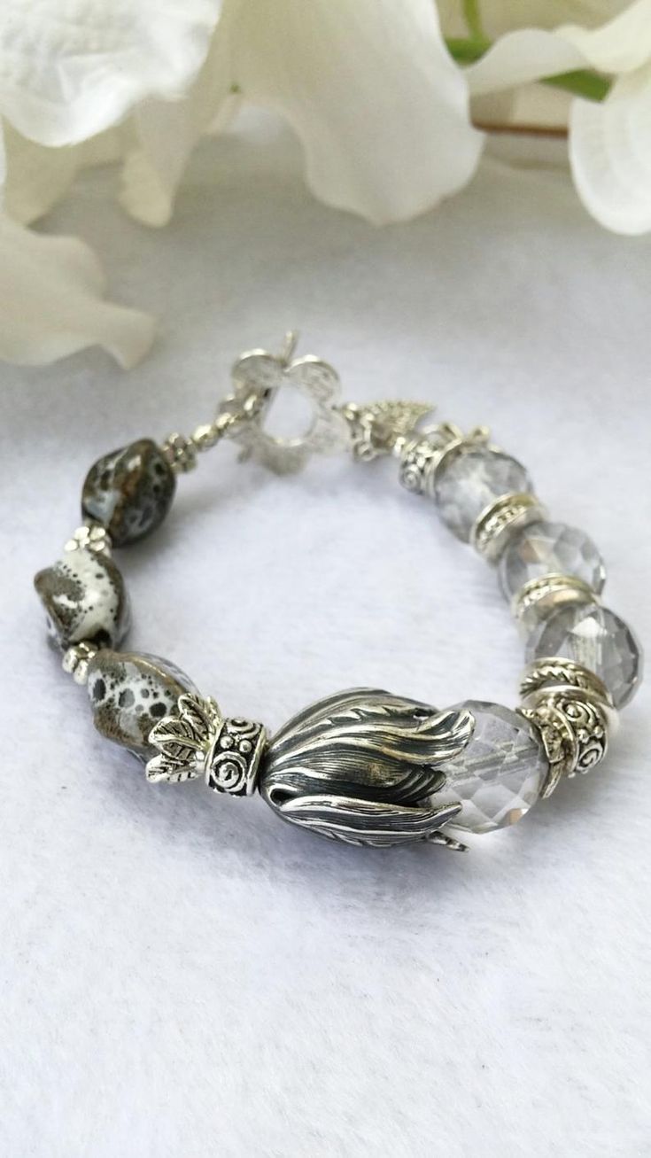 HOLIDAY SALE Boho Beaded Silver Tulip Bracelet Bridesmaid | Etsy Elegant Adjustable Glass Crystal Bracelet, Elegant Glass Beaded Bracelets, Silver Bangle With Faceted Beads, Elegant Silver Hand-strung Crystal Bracelet, Adjustable Gray Bracelet With Faceted Beads, Elegant Gray Round Beads Bracelets, Elegant Gray Bracelet Jewelry, Elegant Gray Round Bead Bracelets, Spiritual Silver Beaded Bracelets For Wedding