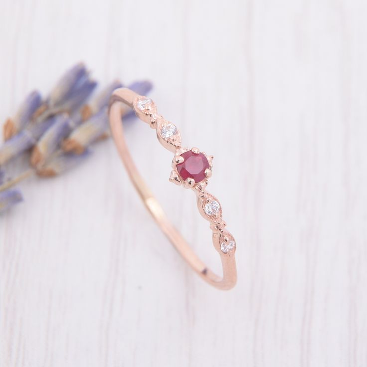 Small & dainty 14k rose gold antique victorian pink ruby engagement ring, Delicate minimalist art deco style ruby promise ring for her WE OFFER UNLIMITED PERIOD INSTALLMENTS PLAN This is a beautiful, stunning, feminine ring that works well for all occasions, styles, and ages. You will love it! Ring information: Main stone: Ruby Approximate size: 2.5mm Accent stones: Cubic zirconia Approximate size: 1.25mm (4 stones) Approximate weight: 0.092ct ( in total) Approximate width of Band: 1.0mm Fro Dainty 14k Rose Gold Promise Ring, Dainty 14k Rose Gold Rings, Elegant Rose Gold Ruby Jewelry, Elegant Pink Jewelry With Lab-created Ruby, Elegant Pink Lab-created Ruby Jewelry, Dainty 14k Rose Gold Solitaire Jewelry, Elegant Ruby Stackable Rings With Round Band, Elegant Ruby Stackable Wedding Rings, Elegant Lab-created Ruby Promise Ring Jewelry