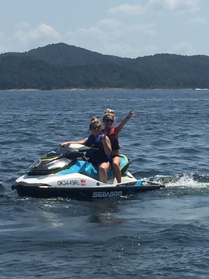 two people on a jet ski in the water