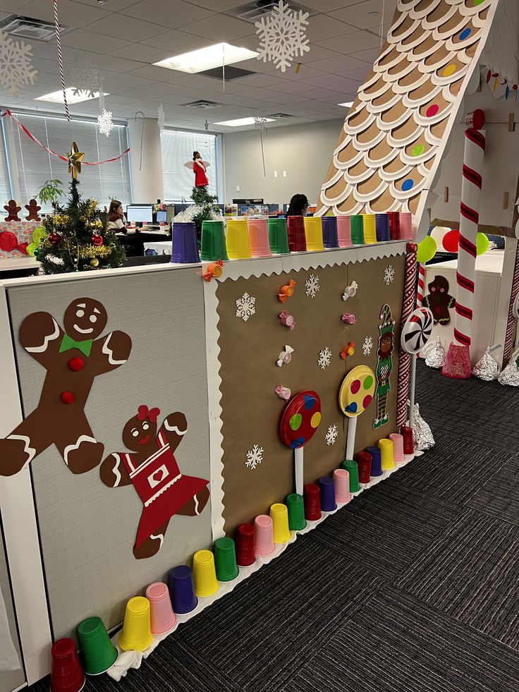 an office decorated for christmas with gingerbreads and candy canes on the wall