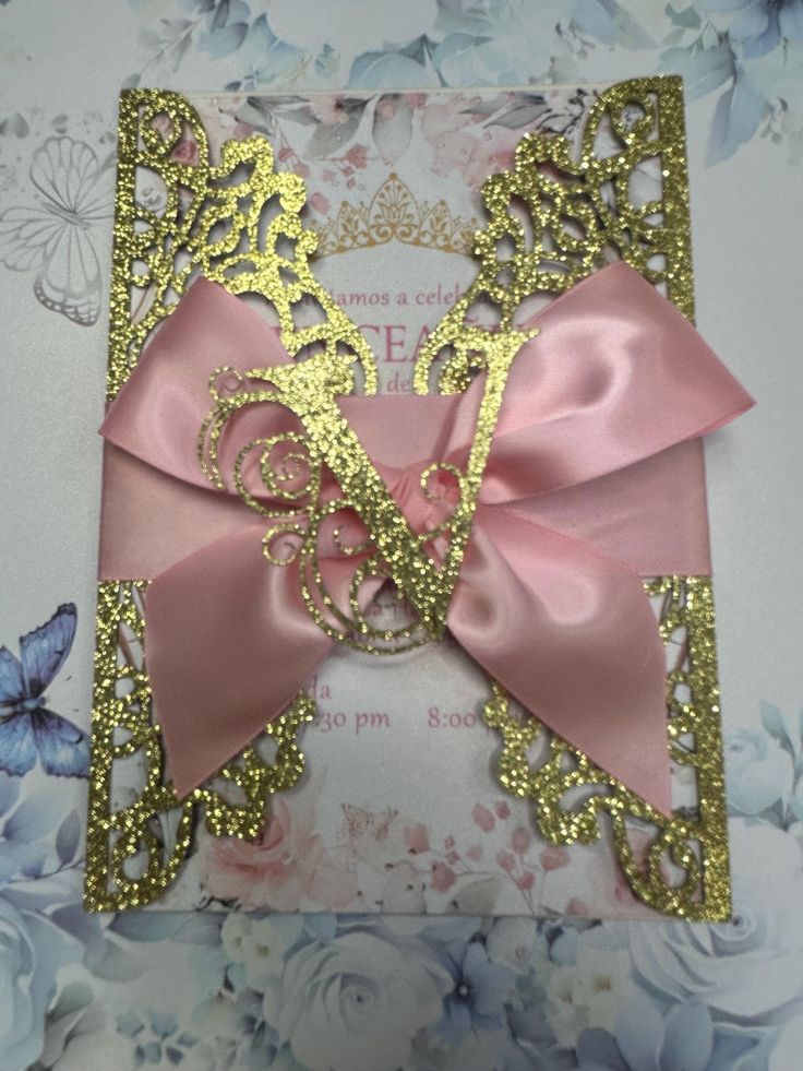 a pink and gold card with a horse on it