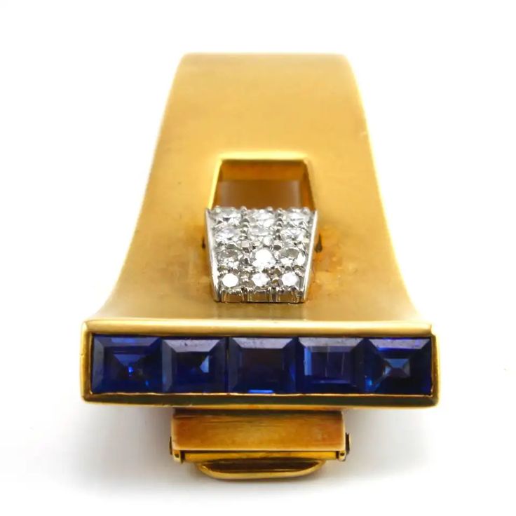 For Sale on 1stdibs - A very sleek and elegant Sapphire and Diamond Clip Brooch made in the 1940s, depicting the typical Retro design. The diamonds weigh circa 1 carats and Elegant Sapphire Brooches For Formal Occasions, Yellow Gold Art Deco Brooches For Formal Wear, Art Deco Yellow Gold Formal Brooches, Art Deco Yellow Gold Brooches For Formal Occasions, Formal Art Deco Yellow Gold Brooches, Art Deco Single Cut Diamond Brooches For Formal Occasions, Formal Art Deco Brooch With Single Cut Diamonds, Formal Yellow Gold Brooches With Single Cut Diamonds, French Wire Earrings