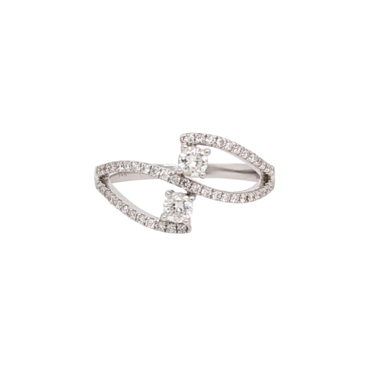 This dual diamond ring features a gorgeous a unique bypass design with natural earth mined diamonds set in solid 14K gold. This two stone diamond ring ring makes a lovely April birthstone gift for your loved ones! This ring is made with solid 14K Gold and natural Earth mined SI / G-H diamonds. As listed, this ring is ready to ship. If you're interested in purchasing this setting with a different center stone please message us! Elegant Diamond Bypass Open Ring, Elegant Diamond Bypass Ring With Open Design, Elegant Diamond Bypass Ring With Open Style, Diamond Bypass Ring For Promise Occasion, Diamond White Bypass Ring With Diamond Accents, Elegant Diamond White Bypass Ring With Single Cut Diamonds, Diamond Bypass Ring With Open Band For Promise, Timeless Diamond Bypass Ring With Brilliant Cut, Timeless Diamond Bypass Ring