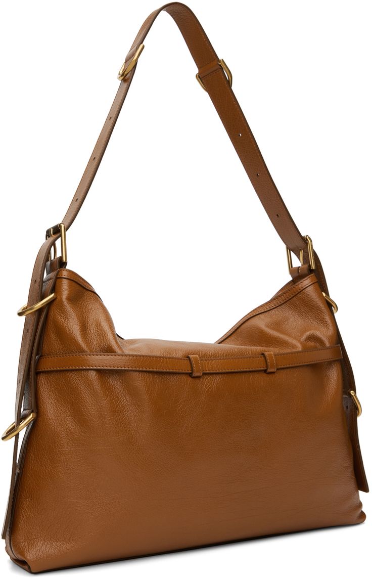 Grained buffalo leather shoulder bag in tan. · Detachable pin-buckle shoulder strap · Logo stamp and pin-buckle straps at face · Open throat · Zip pocket at interior · Canvas lining · Logo-engraved gold-tone hardware · H12.5 x W15.5 x D2 Supplier color: Soft tan Cognac Calf Leather Shoulder Bag With Gold-tone Hardware, Brown Calf Leather Shoulder Bag With Brass Hardware, Crossbody Bag With Brass Hardware In Calf Leather, Calf Leather Crossbody Bag With Brass Hardware, Brown Saddle Shoulder Bag With Gold-tone Hardware, Brown Crossbody Shoulder Bag With Palladium Hardware, Office Shoulder Bag With Brass Hardware And Calf Leather, Calf Leather Shoulder Bag With Brass Hardware For Everyday, Everyday Calf Leather Shoulder Bag With Brass Hardware