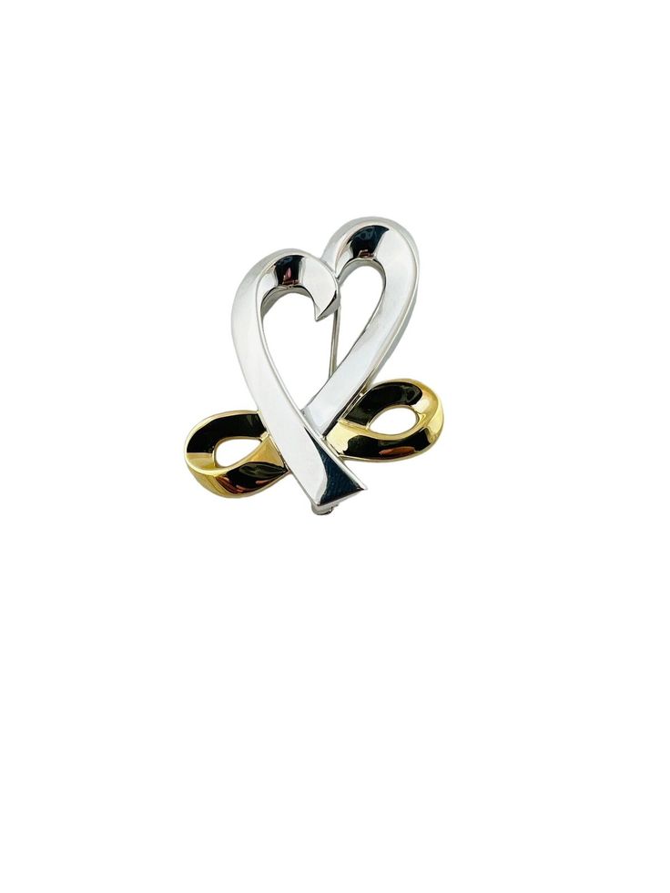 Tiffany & Co. Pablo Picasso 18K Yellow Gold and Sterling Silver Open Heart Infinity Brooch This vintage Tiffany & Co. Pin was designed by Pablo Picasso Approx. 1 1/2" in length and 1 1/4" wide. Stamped Pablo Picasso 925 Tiffany & Co. 750 15.1 g / 9.7 dwt Very good preowned condition. Will be shipped priority mail with insurance. AD10012023/17KC400 Gold Sterling Silver Brooches For Anniversary, Gold Sterling Silver Brooch For Anniversary, Elegant Brooch For Valentine's Day, Tiffany And Co Heart Necklace, Tiffany And Co Earrings Heart, Elegant Valentine's Day Brooch, Elegant Gold Brooches For Valentine's Day, Elegant Gold Brooch For Valentine's Day, Elegant Valentine's Day Brooch Jewelry