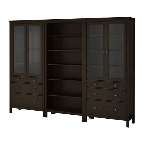 a bookcase with glass doors and drawers in dark wood finish, on an isolated white background