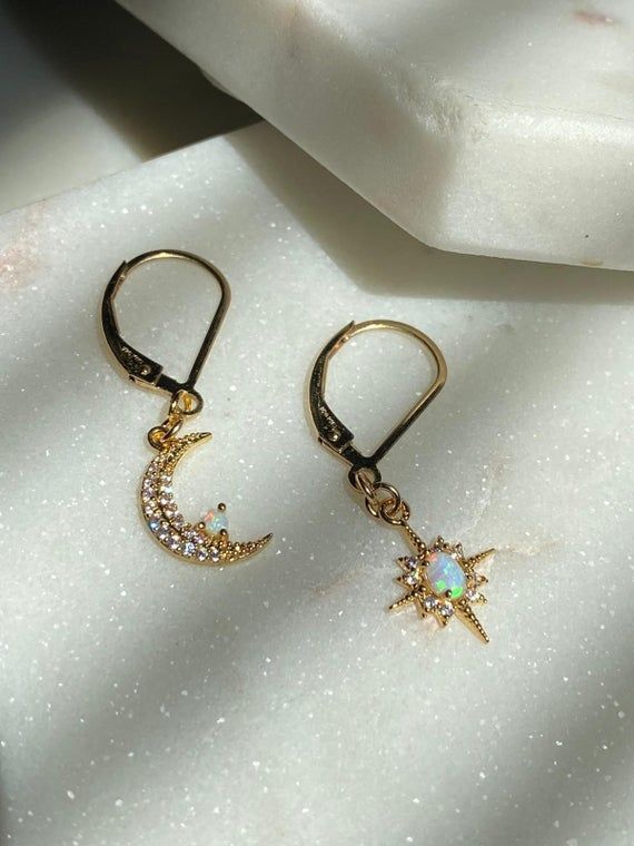 Moon and Star Opal Earrings-Gold Filled Earring Clasps-Dangle Earrings-Celestial Earrings-Gold Moon Earrings-Gold Star Earrings-Opal Earring~~~~~~~~~~~~~~~~~~~~~~~~~~~~~~~~~~~~~ITEM DETAILS* * Gold Plated Opal Moon 8x13mm* * Gold Plated Opal Star 10x13mm* * 14k Gold Filled Leverback earrings🔔✨🔔 Claim your 10% Coupon by signing up to our mailing list (copy and paste link on URL) https://www.subscribepage.com/pinkslate  🔔✨🔔--SHIPPING DETAILS--*No Invoices are included in the package*If standar Celestial Dangle Earrings With Star Charm, Celestial Style Dangle Earrings With Star Charm, Celestial Moon Shaped Earrings With Star Charm, Celestial Star Charm Round Earrings, Celestial Moon Earrings With Star Charm, Celestial Crescent Earrings With Star Charm, Celestial Moon-shaped Earrings With Star Charm, Celestial Drop Earrings With Star Charm, Magical Dangle Jewelry With Moon Charm