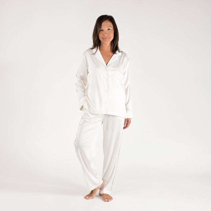 The Birdie Satin Pajamas are certain to become the most refined addition to your loungewear edit. These pajamas are made with luxurious, silky satin that washes beautifully. The button-front top has a notched collar and standard-length sleeves. These are the comfortable, relaxed PJs you’ll live in, gift to everyone, and pack with you wherever you go.Material: Poly-satin fabricSize & Fit: Fits for a more tailored style. Size up if in between sizes. 26.5" InseamCare guide: Machine wash cold with l Elegant Satin Sleepwear For Lounging, Elegant Satin Loungewear, Elegant Silk Sleepwear With Relaxed Fit, White Silk Long-sleeve Sleepwear, White Silk Long Sleeve Sleepwear, Button Front Top, Satin Pajamas, Birdy, Length Sleeve