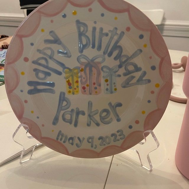 a happy birthday plate is on display for everyone to see in the store or office