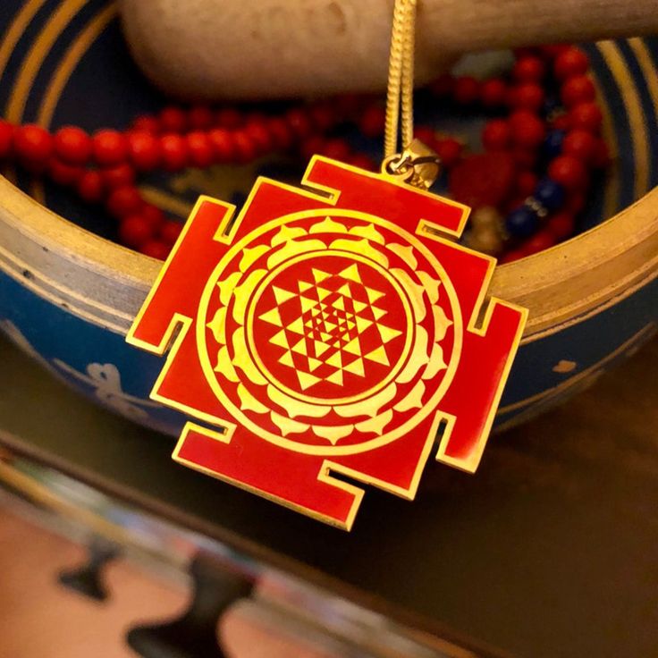 Sri Yantra Red Enamel Pendant, 925 Sterling Silver&Gold Coating, Hindu God Deity, Spiritual Pendant, Yantra Jewelry, Wealth Amulet, Lakshmi Sri Yantra is known as the yantra of the yantras. It consists of nine interconnected triangles surrounding a central point, known as a Bindu.. Sri yantra represents the human body as well as the universal energies. The universe is the macro cosmos and the human body is the micro cosmos. Our physical functions are performed by 43 energy centers. These energie Spiritual Ceremonial Jewelry For Festivals, Spiritual Jewelry For Rituals And Festivals, Red Symbolic Engraved Jewelry, Red Amulet Medallion Jewelry, Symbolic Red Pendant Jewelry, Symbolic Handmade Jewelry For Festivals, Red Spiritual Jewelry For Rituals, Symbolic Engraved Necklace For Festivals, Engraved Jewelry For Puja And Festivals