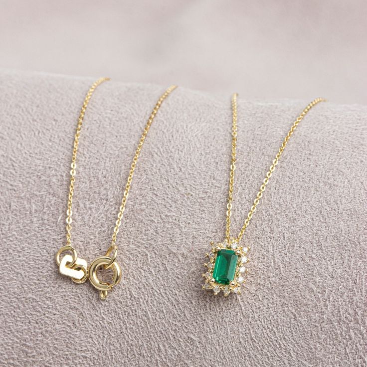 "Emerald, which is considered to be the stone of love, sensitivity and loyalty, is seen as a symbol of harmony in relationships. The green color of the emerald symbolizes luck, youth and rebirth. Our Rectangle Emerald necklace surrounded by 14K Solid Gold diamonds is an elegant jewel for you and your loved ones with its elegant design. Time to pamper yourself and your loved ones... Emerald is the birthstone of May. You can find our matching ring with our necklace here https://queenjewelryturkey. Elegant 14k Gold Emerald Necklace With Delicate Chain, Elegant Gold Plated Emerald Necklace For Gift, Elegant Yellow Gold Necklaces With Rectangular Stone, Elegant May Birthstone Necklace With Rectangular Pendant, Elegant Emerald Necklace With Rectangular Pendant May Birthstone, Elegant Emerald Necklace With Rectangular Pendant For Gift, Elegant Emerald Necklace With Rectangular Pendant For May Birthstone, Elegant Rectangular Emerald Pendant Necklace As Gift, Elegant Emerald Necklace With Rectangular Pendant