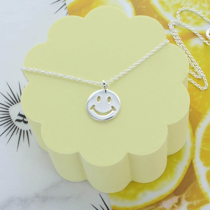 A simply fun and happy sterling silver necklace with a happy smiley face in the centre. Dimensions Available with a 16" or 18" chain Made from sterling silver Smiley Face Necklace, Happy Smiley Face, Silver Gift Wrap, Face Necklace, Silver Logo, Gift Wrapping Services, White Gift Boxes, Silver Gifts, Happy Face