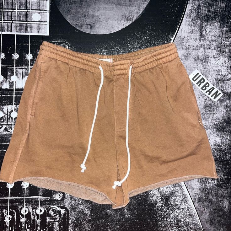 Nwt Bdg Bonfire Cutoff Shorts Color: Blush (Brown) Size: Medium Washed-Soft And Faded Sweatshorts From The Essential Bdg Label. Features A 6" Inseam With Cutoff Hems. Fitted With Pockets And An Adjustable Tie At The Waist. Urban Outfitters Exclusive. Features: - Sweatshorts From Bdg - Cutoff Hems - Adjustable Tie Waist - Uo Exclusive Content + Care: - 80% Cotton, 20% Polyester - Machine Wash Size + Fit: - Model Is 6’0" And Wearing Size Medium - Measurements Taken From Size Medium - Rise: 12" - I Sporty High Waist Cotton Shorts, High Rise Cotton Shorts For Streetwear, Casual Bottoms With Built-in Shorts For Weekend, Trendy Brown Shorts, Brown Cotton Shorts For Streetwear, Brown Cotton Shorts For Day Out, Trendy Brown Shorts For Day Out, Casual Brown Cotton Shorts, Casual Brown Shorts For Day Out