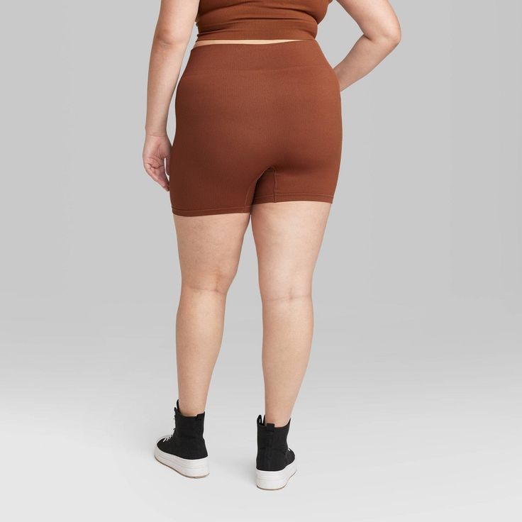 Seamless bike shorts from Wild Fable™ in a solid hue with ribbed texture. Made of a soft fabric with spandex. Tailored in a high-rise and slim-fit silhouette. Pull-on waist with full elastic completes the look. If you’re not satisfied with any Target Owned Brand item, return it within one year with a receipt for an exchange or a refund. Wild Fable™: A look for every story. Sporty Stretch Brown Biker Shorts, Solid Stretch Seamless Biker Shorts, Solid Fitted Seamless Biker Shorts, Brown Stretch Biker Shorts For Athleisure, High Stretch Seamless Biker Shorts For Loungewear, Seamless High Stretch Biker Shorts For Loungewear, Stretch Seamless Solid Color Biker Shorts, Stretch Seamless Solid Biker Shorts, Seamless Stretch Solid Biker Shorts