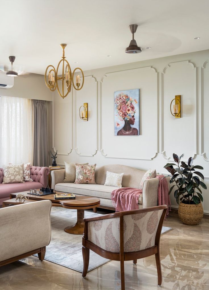 a living room filled with furniture and a chandelier