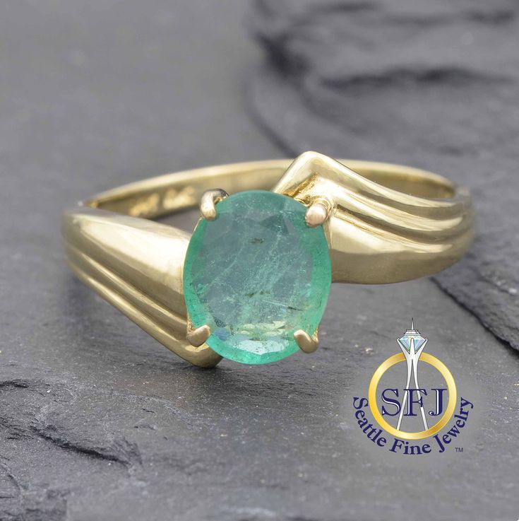 "Natural Emerald Ring, Solid Yellow Gold, Art Deco Bypass Ring. METAL: Solid Yellow Gold, Stamped 10K GEMS: 1 Natural Emerald-- 1.05 ct CURRENT SIZE: 7 1/4. Expert resizing available. CURRENT RING SIZE:  7 1/4 (Expert resizing service available. Safe resize range for this ring:  5 1/2--9 1/2. See below to purchase resizing.) CONDITION: New Gemstone in Expertly Restored Vintage Setting APPRAISED VALUE: $8,825 *You will receive the exact, one-of-a-kind item pictured.* WHAT SETS SEATTLE FINE JEWELR Luxury Solitaire Emerald Ring For Formal Occasions, Gia Certified Oval Collectible Ring, Collectible Heirloom Solitaire Ring, Gia Certified Yellow Gold Emerald Ring For Formal Occasions, Formal Gia Certified Yellow Gold Emerald Ring, Timeless Emerald Ring With Polished Finish, Timeless Polished Emerald Ring For Formal Occasions, Heirloom Style Emerald Rings With Polished Finish, Formal Polished Emerald Ring With Round Band