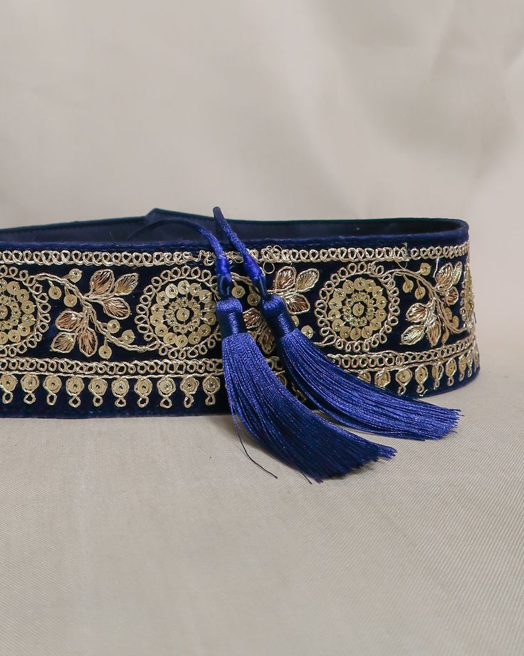 Embroidered obi belt with tassels, handmade in Paris using embroidered indian laces sourced in the mythic city of Jaipur. They are the perfect accessory to transform any boring dress in a boho statement piece.  We love it's exotic & vintage look and we are sure you will love it too!  HOW TO CLOSE THE BELT:  The belt features satin straps with tassels at the end that you can tie around your waist to show the tassels on the front or at the back.  MATERIALS: The belts are lined with a linen or cott Traditional Embroidered Fabric For Party Festivals, Traditional Embroidered Fabric For Party And Festivals, Traditional Wear With Tassels For Festivals, Traditional Wear With Tassels For Eid, Festive Traditional Wear With Tassels For Navratri, Navratri Festive Traditional Wear With Tassels, Elegant Dupatta For Festive Occasions, Bohemian Traditional Wear With Tassels For Festive Occasions, Traditional Tasseled Dupatta For Eid