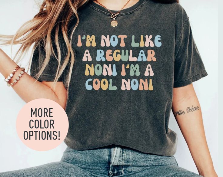 This I'm Not Like A Regular Noni I'm A Cool Noni shirt is the perfect birthday gift, Mother's Day gift, or Christmas gift for all grannys! All of our shirts are made with the highest quality materials and are super soft and cozy! 💚 HOW TO ORDER 💚 1. Check our photos for sizing and color options. 📏 2. Choose your quantity.  Feel free to add as many shirts as you wish! ✨ 3. Select your size and color from the drop-down menus. ✨ 4. Click "ADD TO CART" to add the shirt to your virtual cart. 🛒 5. Trendy Birthday Tops With Funny Text, Trendy Tops With Funny Text For Mother's Day, Casual Multicolor Shirt For Mother's Day, Casual Birthday Shirt With Funny Text, Casual Birthday Slogan Shirt, Retro Letter Print Tops For Gifts, Retro Letter Print Tops As Gift, Multicolor Text Print Top As A Gift, Multicolor Text Print Top As Gift